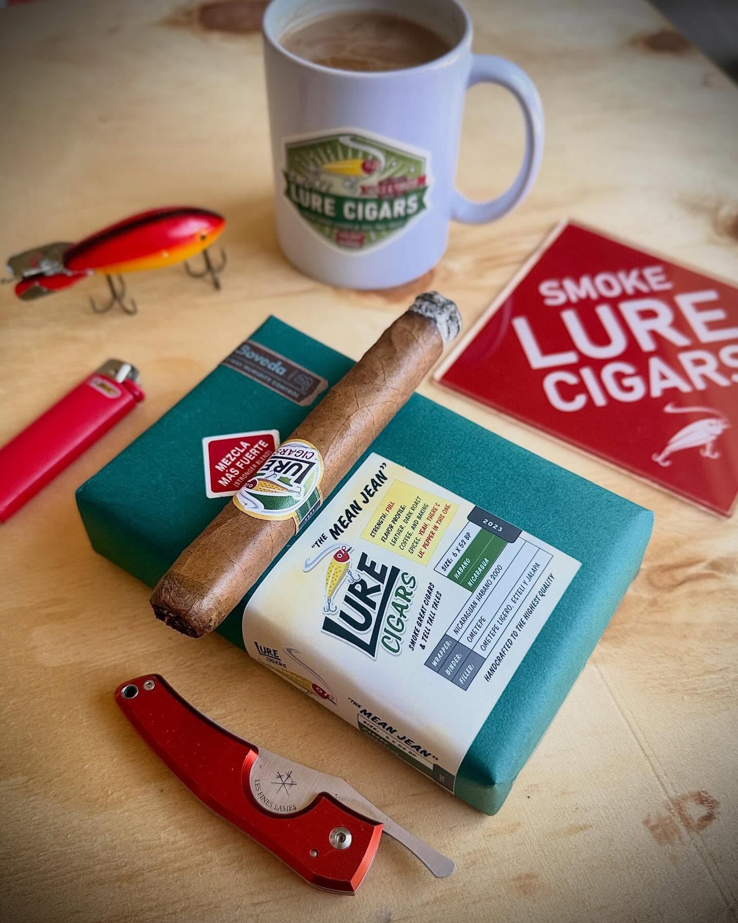 “The Mean Jean” 6x52 Box Press Habano 2000 is a amped up version of @lurecigars Habano line. A higher ratio of Ometepe Ligero brings a stronger profile to the already solid notes of leather, baking spices and coffee with a touch of bright citrus notes. Seek out this one out if you’re looking to catch a great cigar. Sold in 10-packs with @bovedainc humidifcation.

‘Smoke Great Cigars & Tell Tall Tales!’
🔥🎣💨

#cigars #lurecigars #meanjean #smokegreatcigarstelltalltales #nowsmokingacigar